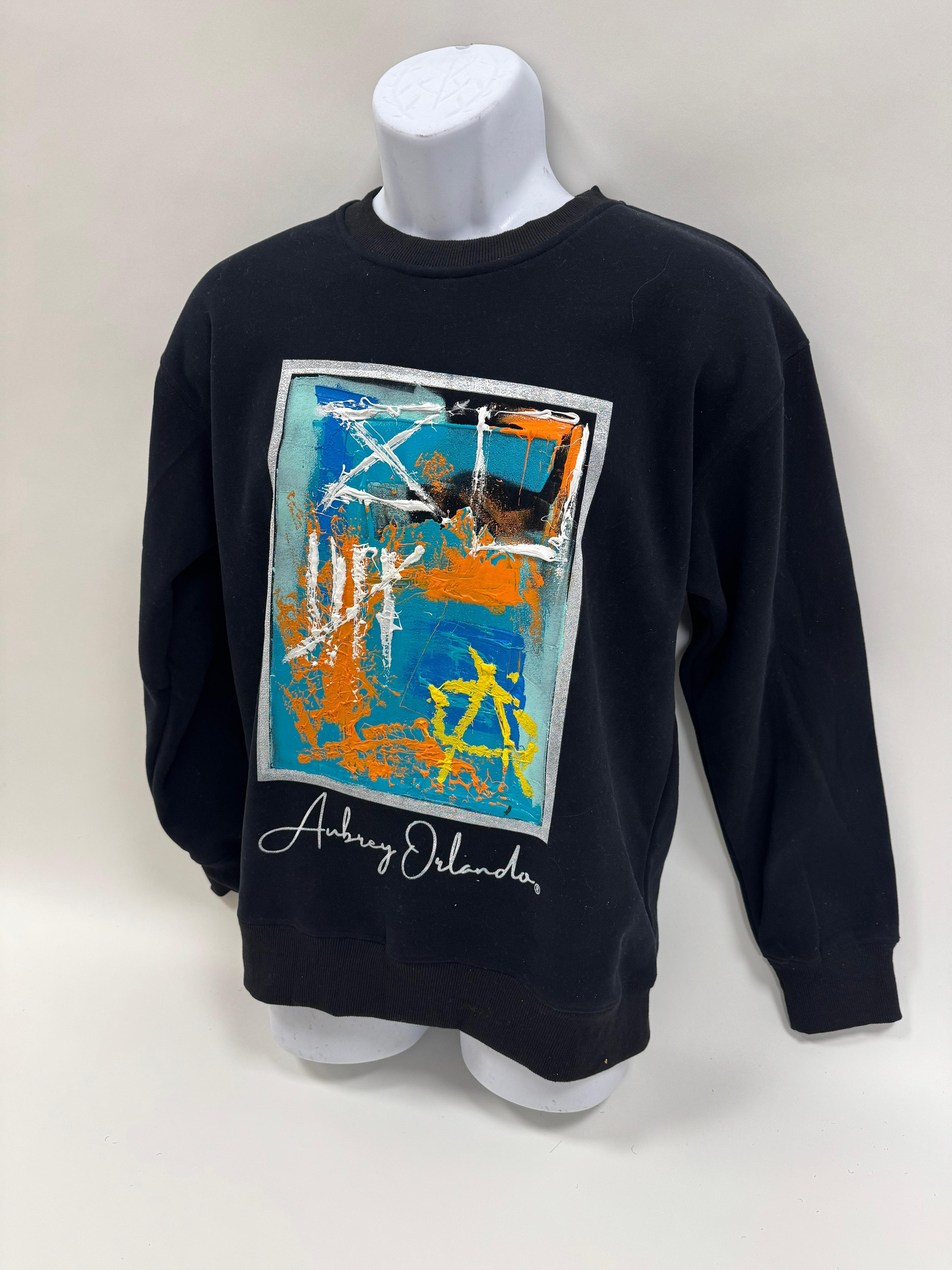 Black crewneck with hand-painted teal, orange and white abstract patch